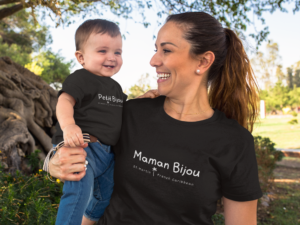 baby-boy-smiling-with-his-mom-wearing-different-round-neck-t-shirts-mockup-outdoors-a16103