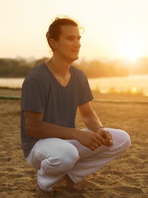heathered-v-neck-tee-mockup-of-a-man-in-a-squatting-pose-at-the-beach-m3998-r-el2