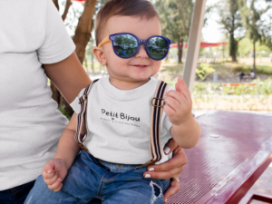 little-baby-boy-wearing-big-sunglasses-and-a-round-neck-tee-mockup-with-his-mom-a16080