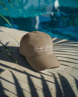 summer-mockup-featuring-an-embroidered-dad-hat-lying-near-the-pool-m40688