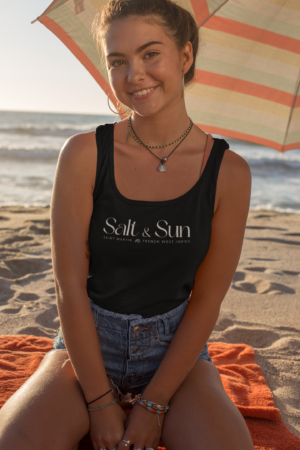 tank-top-mockup-of-a-smiling-woman-sitting-under-a-beach-parasol-26780