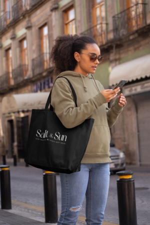 tote-bag-mockup-of-a-woman-in-the-street-checking-her-phone-28848