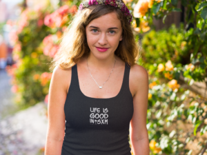 trendy-girl-wearing-a-tank-top-in-a-garden-mockup-a12205